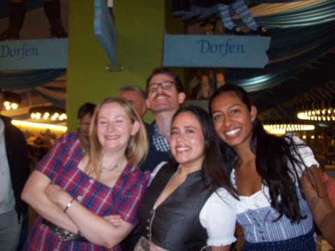 Colleagues smiling together at the Oktoberfest